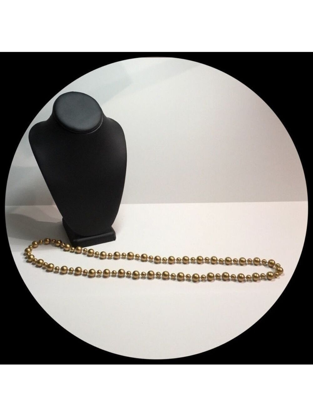 Lovely long gold tone beaded necklace.